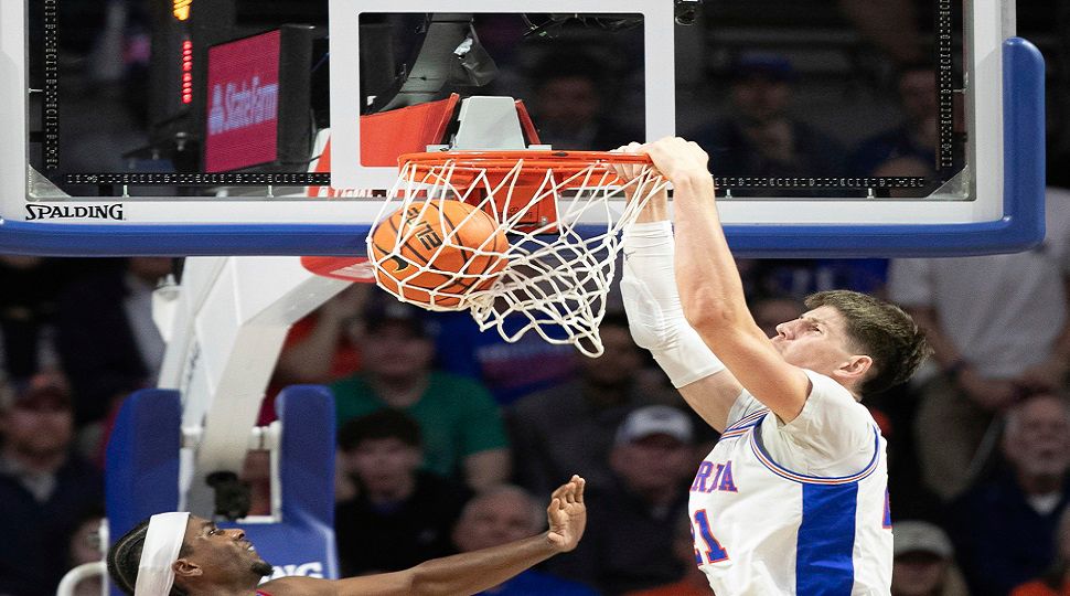 Florida forward Alex Condon dunks during the first half of an NCAA college basketball game against Mississippi, Saturday, March 8, 2025, in Gainesville, Fla. (AP Photo/Alan Youngblood)