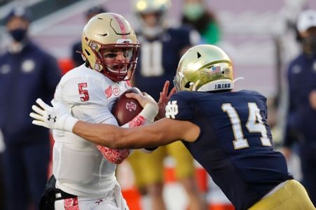 FILE - Ohio State quarterback Justin Fields is sacked by Clemson defensive  lineman Bryan Bresee during the second half of the Sugar Bowl NCAA college  football game in New Orleans, Jan. 1