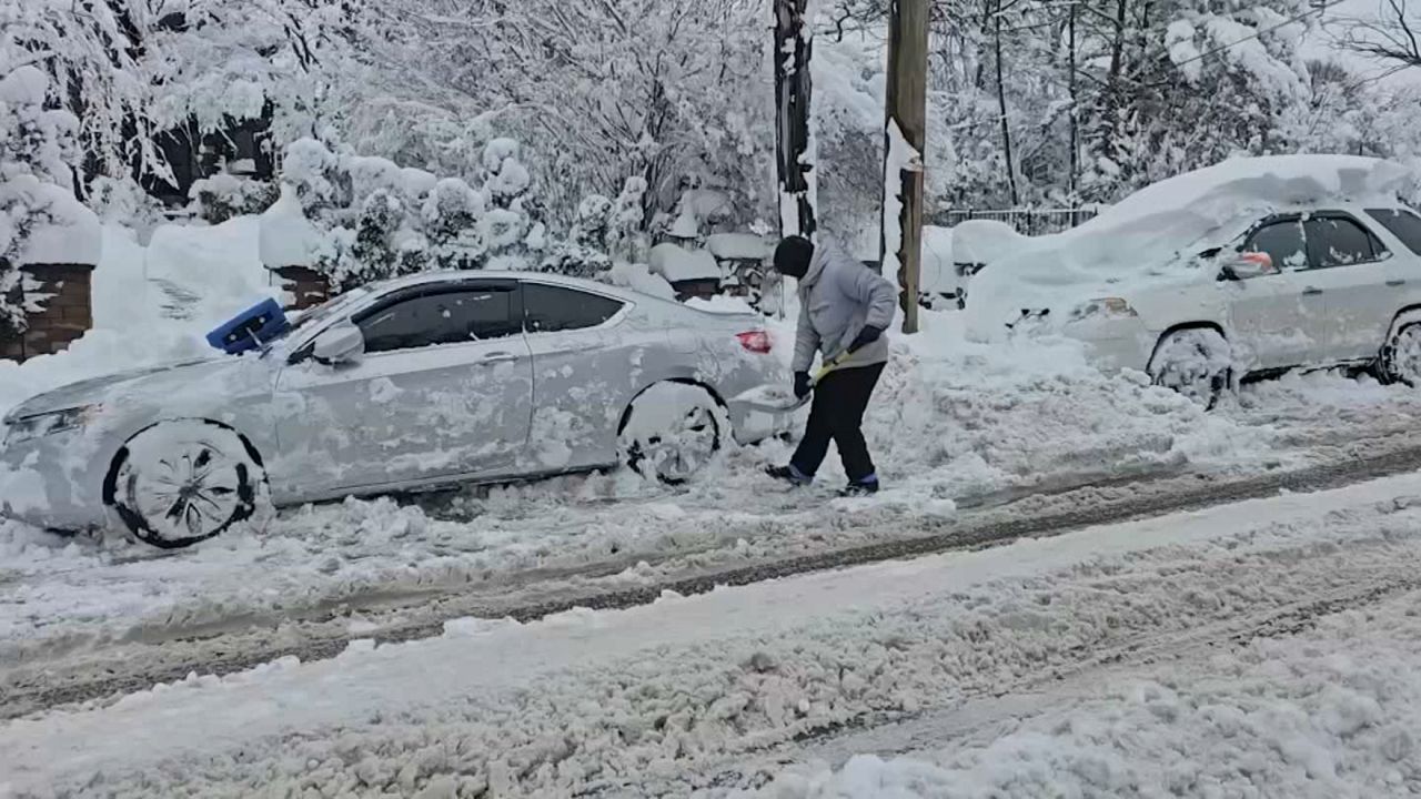 Students brave snowy streets heading back to school after day off