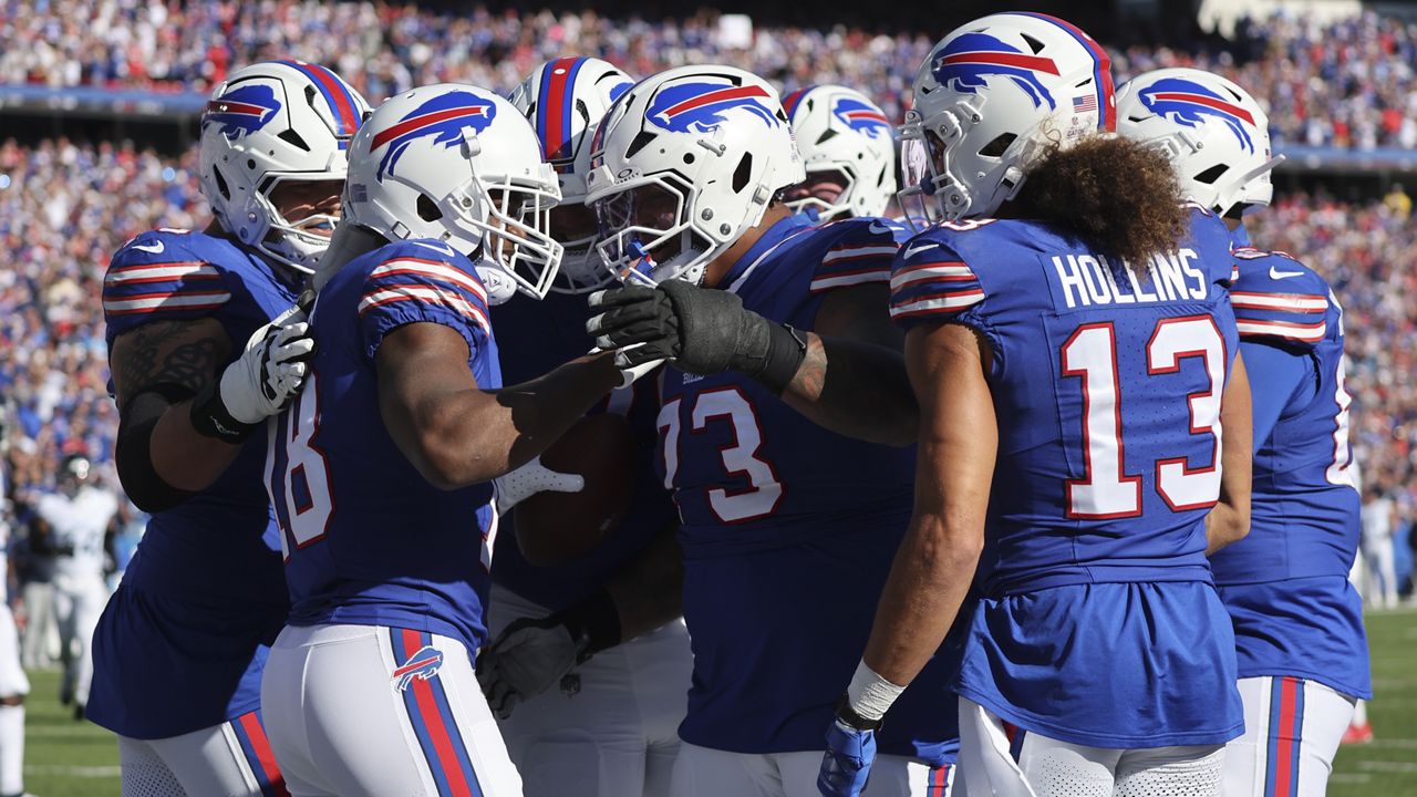 Buffalo Bills wide receiver Amari Cooper (18) celebrates his touchdown with teammates during the second half of an NFL football game against the Tennessee Titans, Sunday, Oct. 20, 2024, in Orchard Park, N.Y. (AP Photo/Jeffrey T. Barnes)