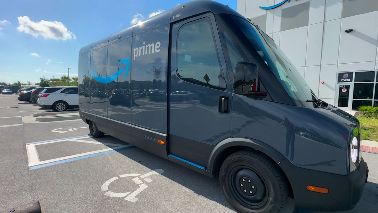 Amazon electric vehicle sits outside the distribution center in Land O' Lakes.