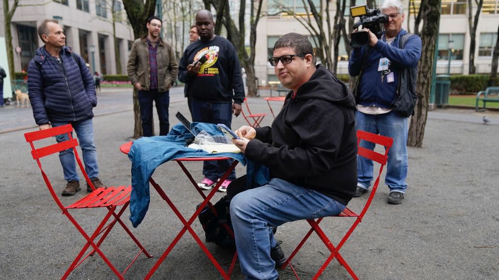 Jason Anthony, an Amazon worker and union organizer, keeps track of the ongoing count of votes to unionize an Amazon warehouse outside an office of the National Labor Relations Board in New York, on May 2, 2022. (AP Photo/Seth Wenig)