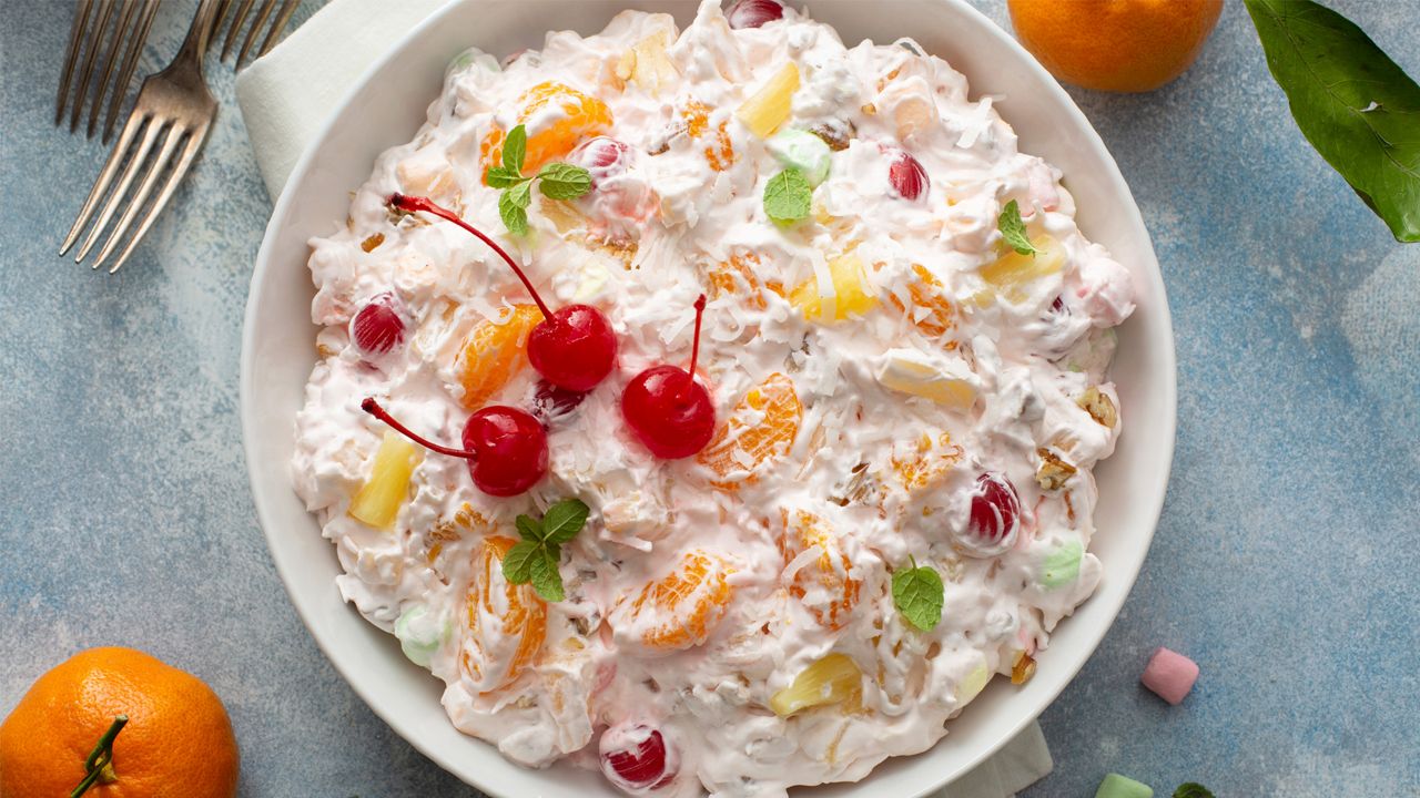 This December 2020 photo shows a recipe for Ambrosia salad for the food blog My Baking Addiction in Suwanee, Ga. The fluffy fruit concoction has a history dating back more than 100 years. (Elena Vaselova for My Baking Addiction via AP).