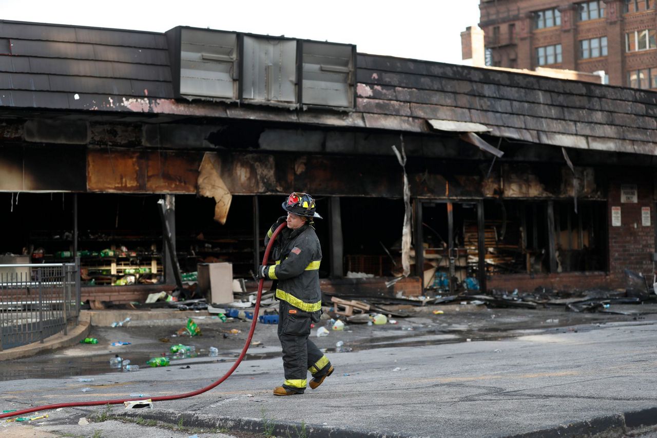 The Latest: Police say 4 officers shot in St. Louis protests