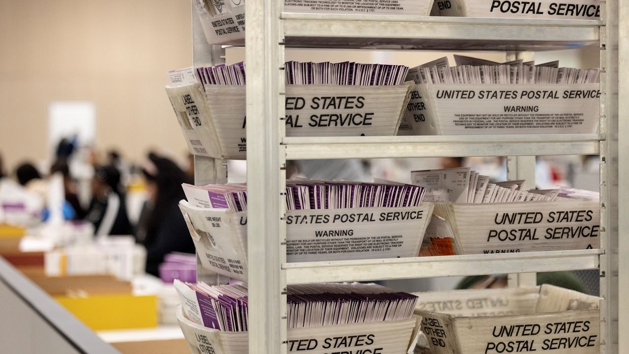 Employees sort ballots at Los Angeles County Election Center on Election Day, Tuesday, Nov. 5, 2024, in City of Industry, Calif. (AP Photo/Etienne Laurent)