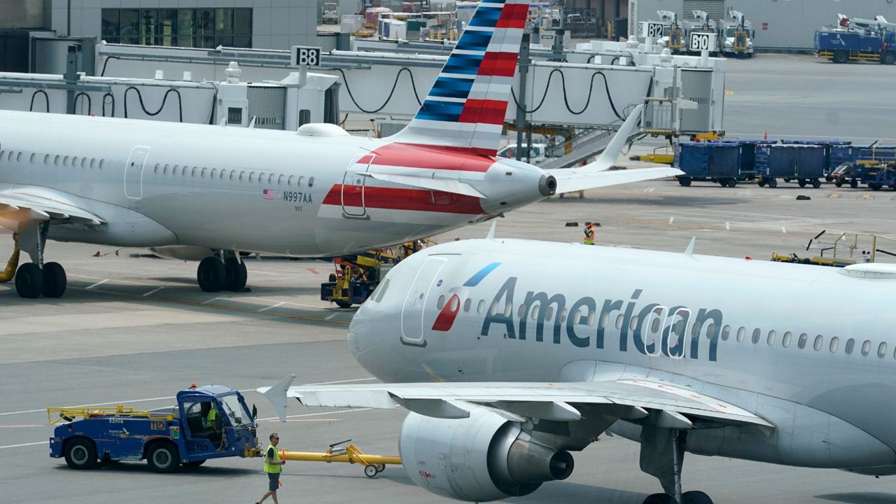 American Airlines passenger jets prepare for departure, July 21, 2021, near a terminal at Boston Logan International Airport in Boston. (AP Photo/Steven Senne, File)