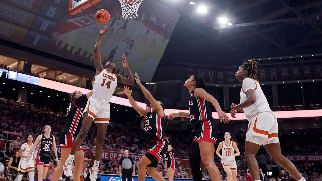 Texas forward Amina Muhammad (14) shoots over Texas Tech guard Loghan Johnson (23) during the second half of an NCAA college basketball game in Austin, Texas, Wednesday, Feb. 21, 2024. (AP Photo/Eric Gay)