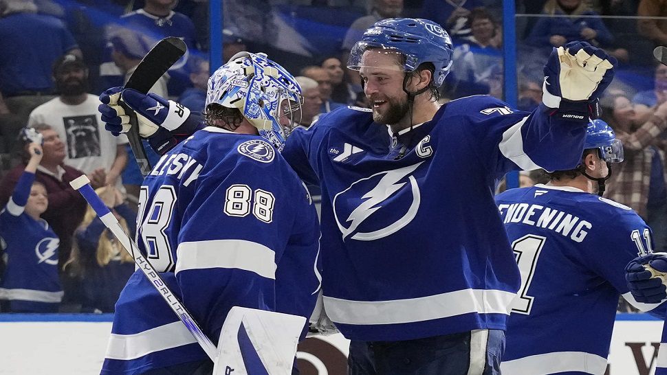 Tampa Bay goaltender Andrei Vasilevskiy celebrates with captain Victor Hedman after winning his 300th NHL game on Thursday night at Amalie Arena.