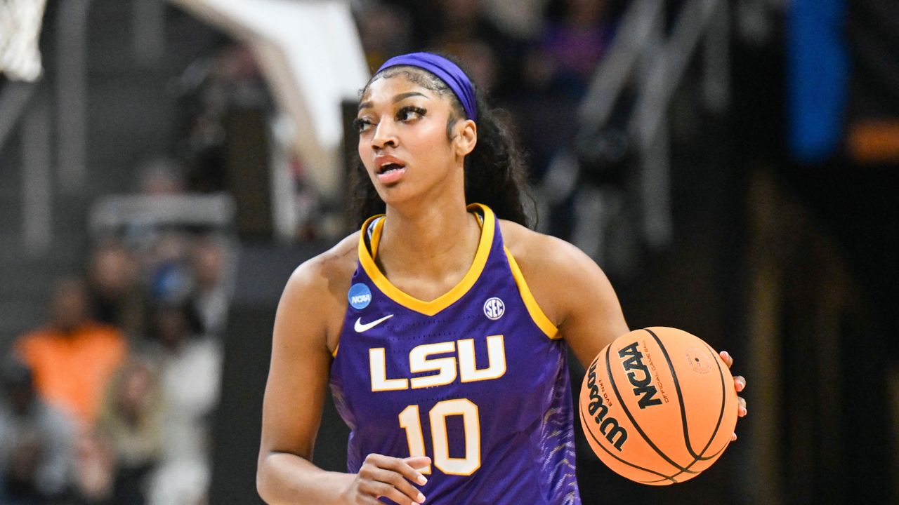 LSU forward Angel Reese (10) moves the ball against Iowa during the first half of a Elite Eight college basketball game in the NCAA Tournament, Monday, April 1, 2024, in Albany, N.Y.