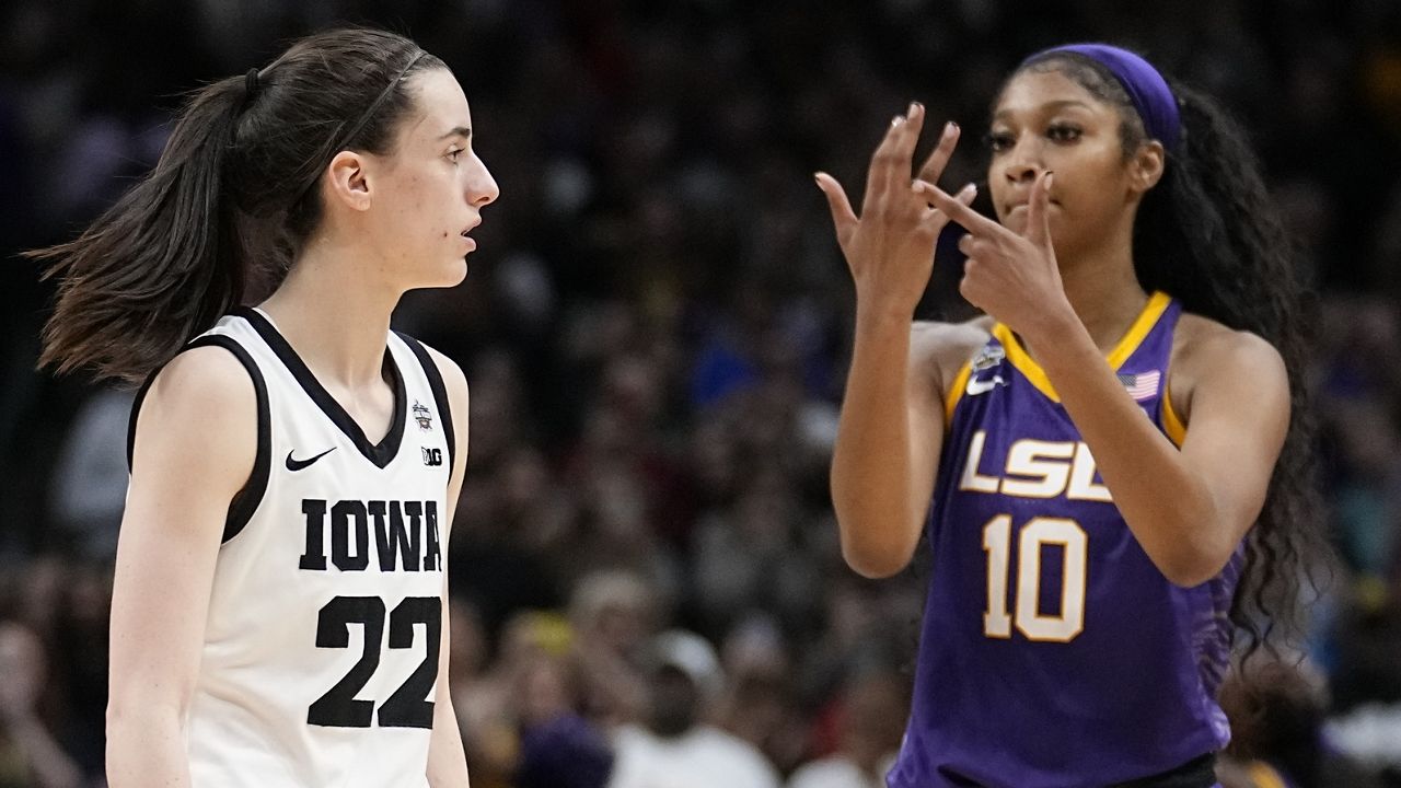 LSU's Angel Reese reacts in front of Iowa's Caitlin Clark during the second half of the NCAA Women's Final Four championship basketball game April 2, 2023, in Dallas. Iowa and LSU are getting ready to meet again in a rematch of the 2023 national championship game on Monday, April 1, 2024. (AP Photo/Tony Gutierrez, File)