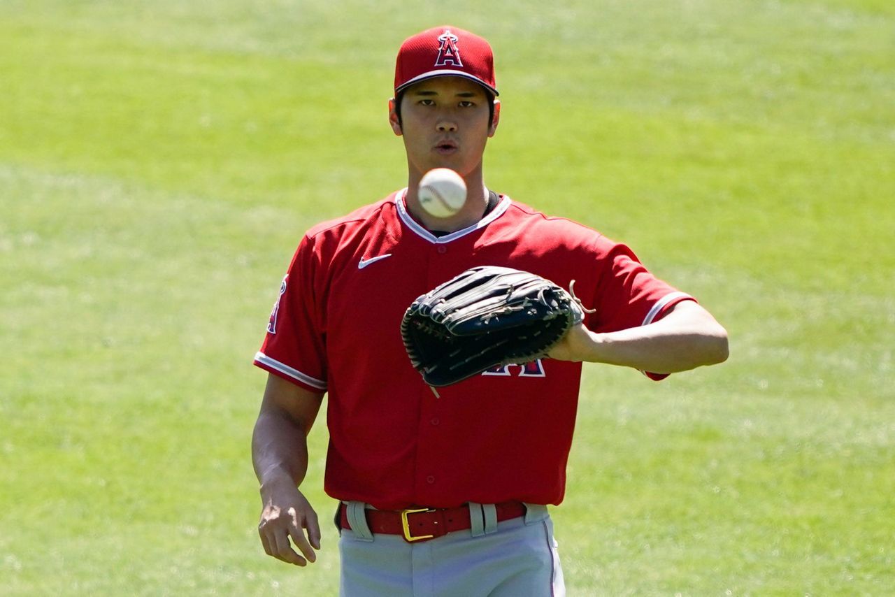 Los Angeles Angels' Shohei Ohtani stretches during a spring