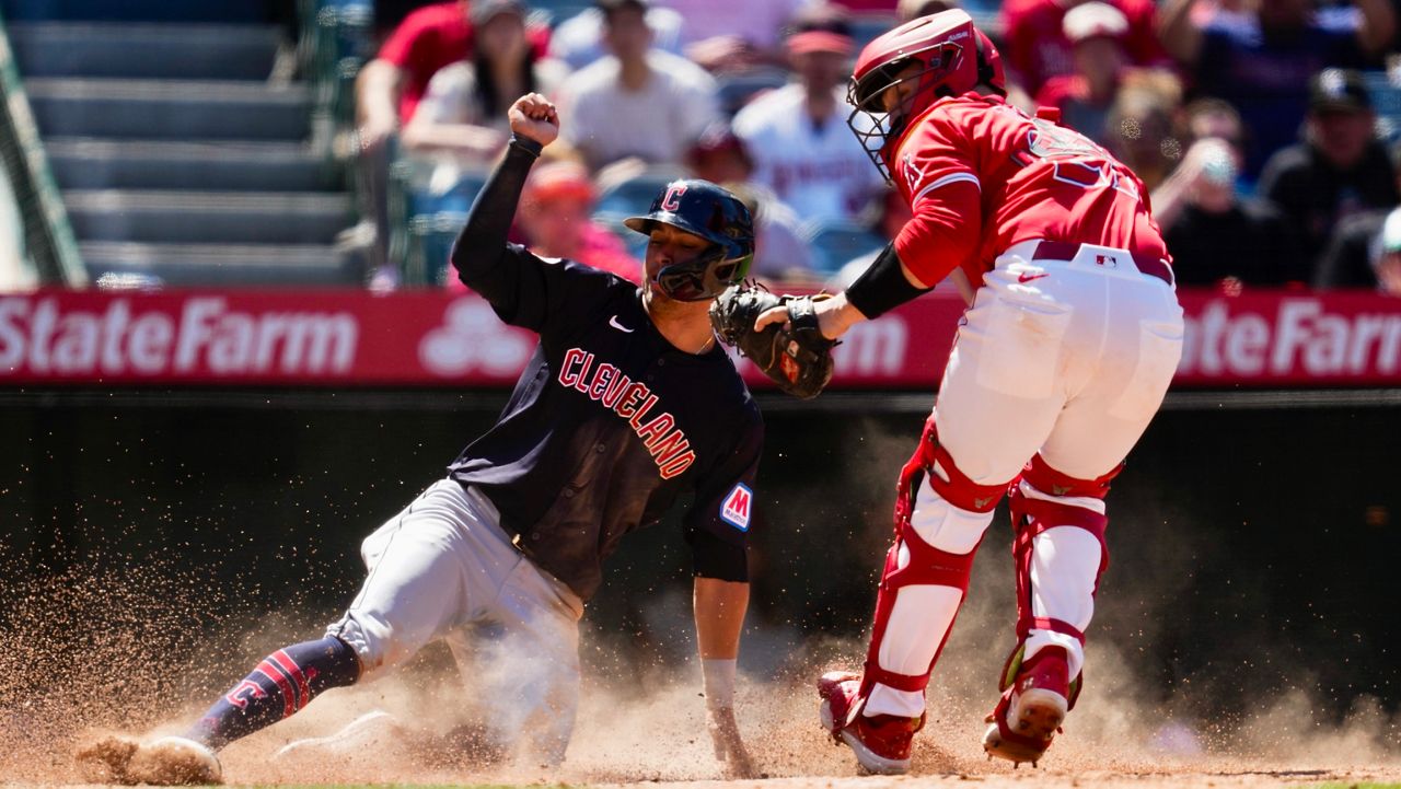 Los Angeles Angels catcher Matt Thaiss, right, tags out Cleveland Guardians' Tyler Freeman at home during the eighth inning of a baseball game in Anaheim, Calif., Sunday, May 26, 2024. (AP Photo/Ashley Landis)