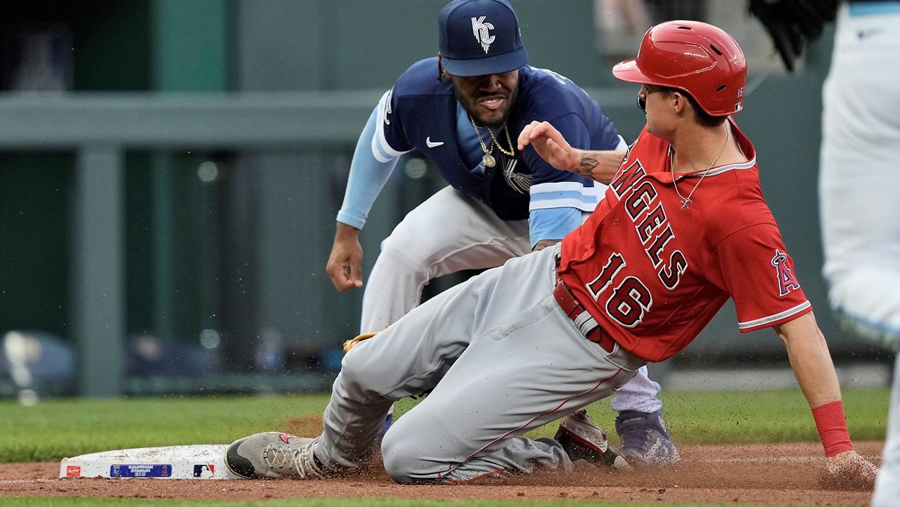 Los Angeles Angels' Mickey Moniak (16) is caught stealing third by Kansas City Royals third baseman Maikel Garcia during the third inning of a baseball game Friday, June 16, 2023, in Kansas City, Mo. (AP Photo/Charlie Riedel)