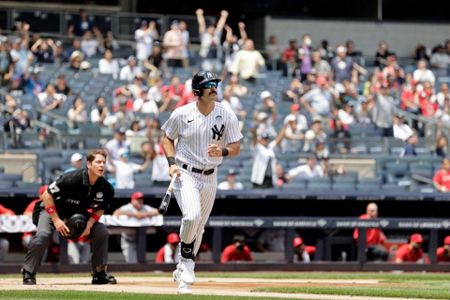 New York Yankees' Matt Carpenter, left, celebrates as he runs the bases  after hitting a two-run home run during the first inning of a baseball game  against the Los Angeles Angels Tuesday