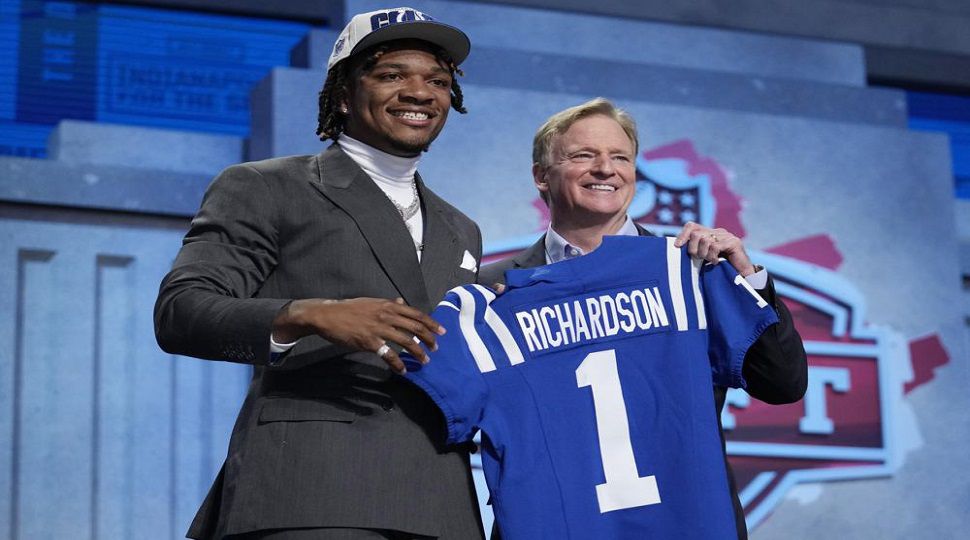 Florida quarterback Anthony Richardson, left, poses with NFL Commissioner Roger Goodell after being chosen by the Indianapolis Colts with the fourth overall pick during the first round of the NFL football draft, Thursday, April 27, 2023, in Kansas City, Mo. (AP Photo/Jeff Roberson)