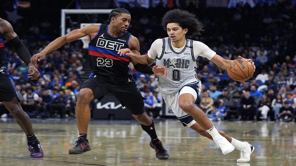 Orlando Magic guard Anthony Black drives past Detroit Pistons guard Jaden Ivey on Saturday night.