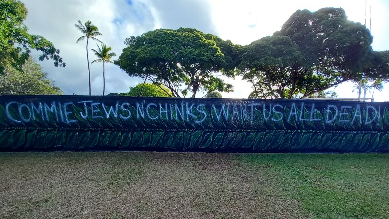 At the heavily trafficked corner of University Avenue and Dole Street on the University of Hawaii at Manoa’s campus, someone graffitied an antisemitic and anti-Asian message. “It hits deep,” said Daphne Desser, especially considering that many of her relatives did not survive the Holocaust. (Photo courtesy of Daphne Desser) 