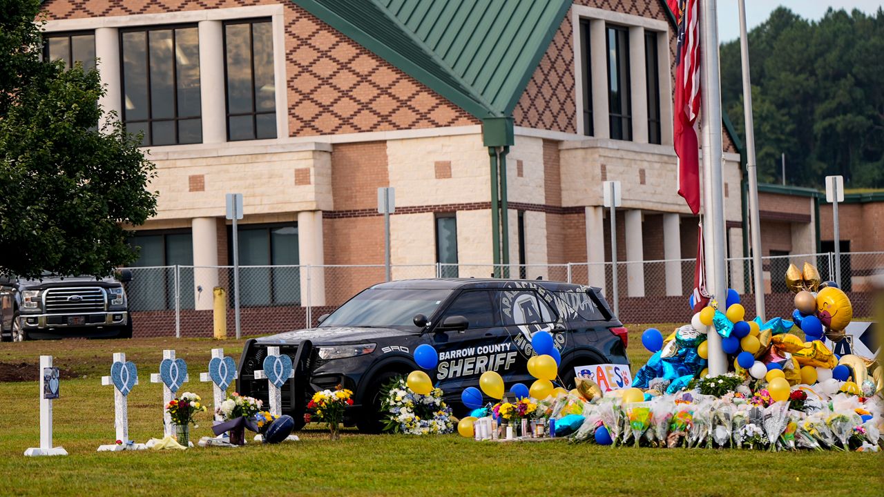 A memorial is seen at Apalachee High School after the Wednesday school shooting, Saturday, Sept. 7, 2024, in Winder, Ga. (AP Photo/Mike Stewart)