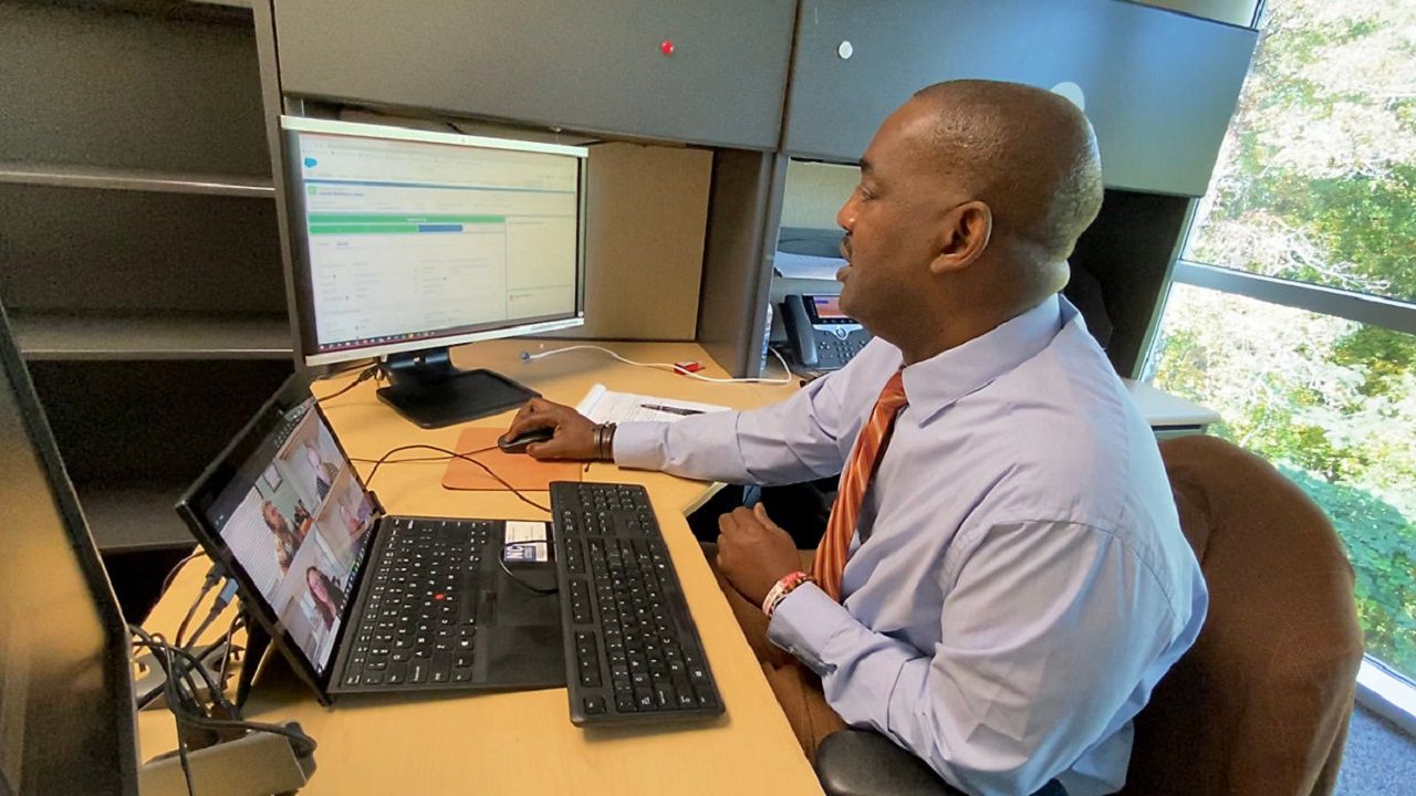 Eric Tillmon giving presentation of NC database (Spectrum News 1/Zyneria Byrd)