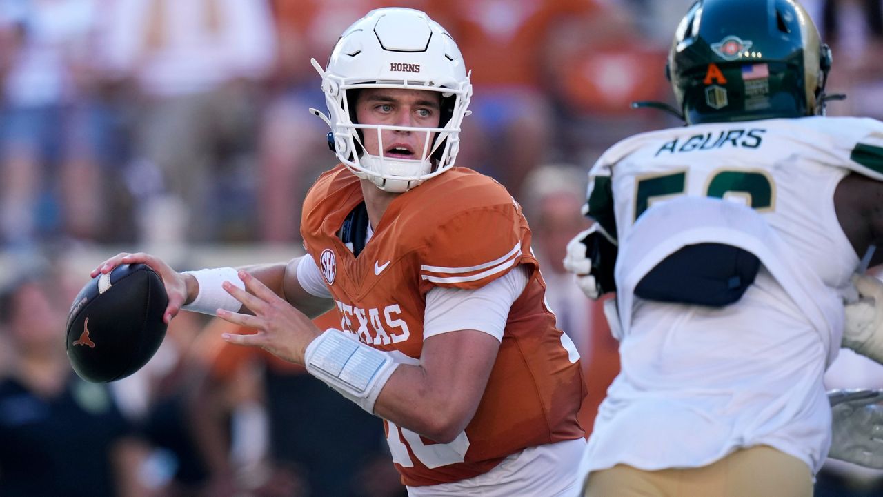 Texas quarterback Arch Manning, left, throws against Colorado State during the second half of an NCAA college football game in Austin, Texas, Saturday, Aug. 31, 2024. (AP Photo/Eric Gay)