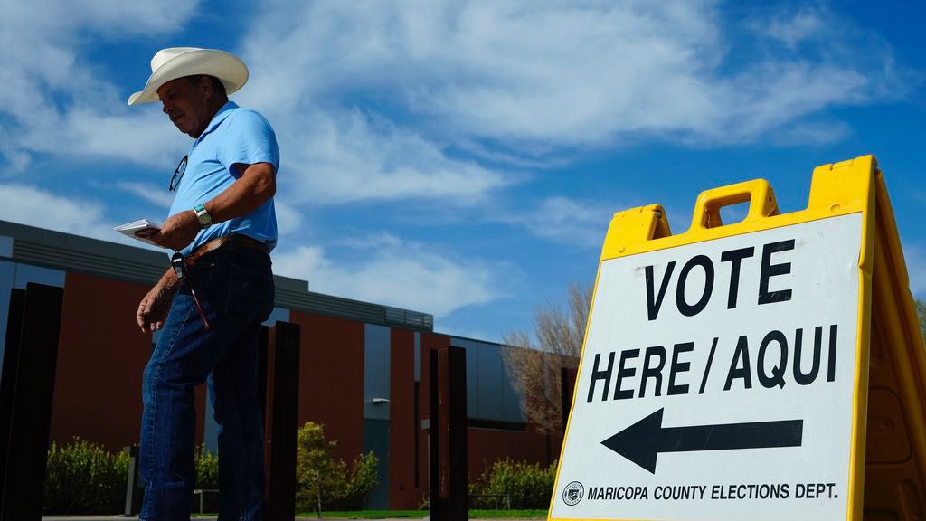 A voter walks to a voting precinct prior to casting his ballot in the state's primary election, Tuesday, July 30, 2024, in El Mirage, Ariz. (AP Photo/Ross D. Franklin, File)