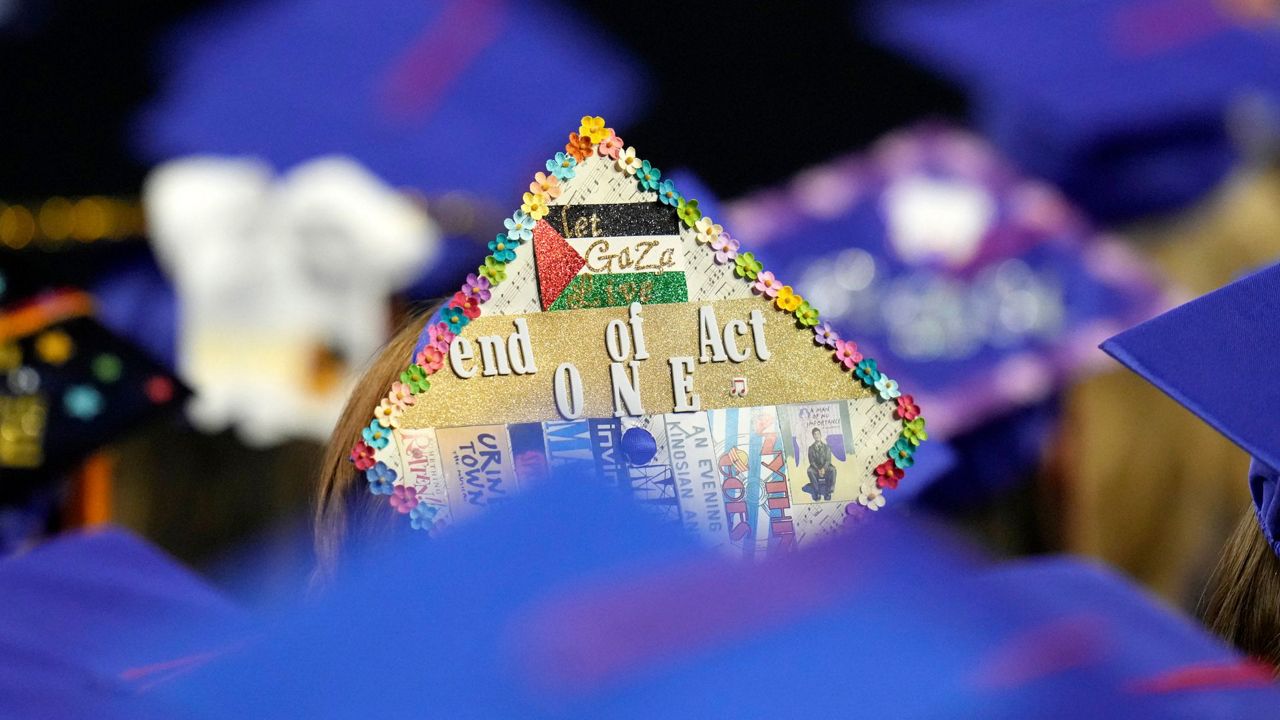 A student wears a Palestinian flag decoration on a graduation mortarboard as first lady Jill Biden speaks at the Mesa Community College commencement Saturday, May 11, 2024, in Tempe, Ariz. (AP Photo/Ross D. Franklin)