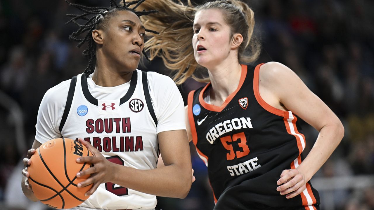 South Carolina forward Ashlyn Watkins (2) drives against Oregon State forward Kelsey Rees (53) during the first quarter of an Elite Eight round college basketball game during the NCAA Tournament, Sunday, March 31, 2024, in Albany, N.Y. (AP Photo/Hans Pennink)