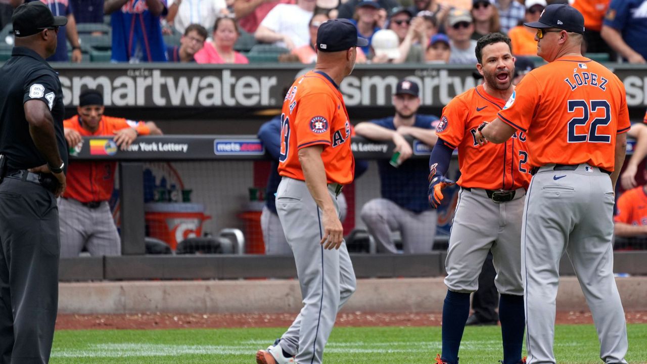 Houston Astros' Jose Altuve, second from right, argues on the field before being ejected by umpire James Jean during the seventh inning of a baseball game against the New York Mets, Sunday, June 30, 2024, in New York. (AP Photo/Pamela Smith)