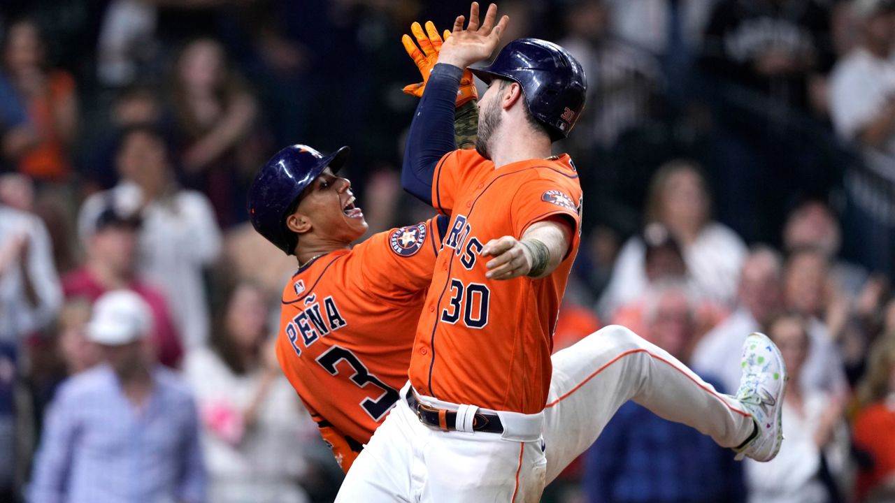 Altuve breaks out with 3 hits as Astros even World Series