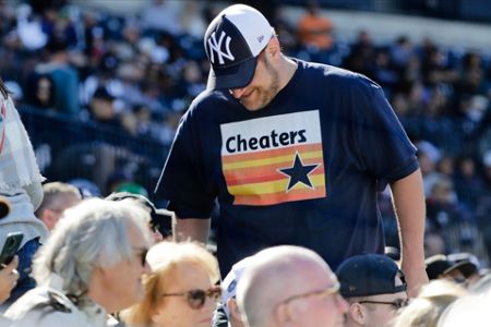 Fans heckling Astros spring opener get signs stolen