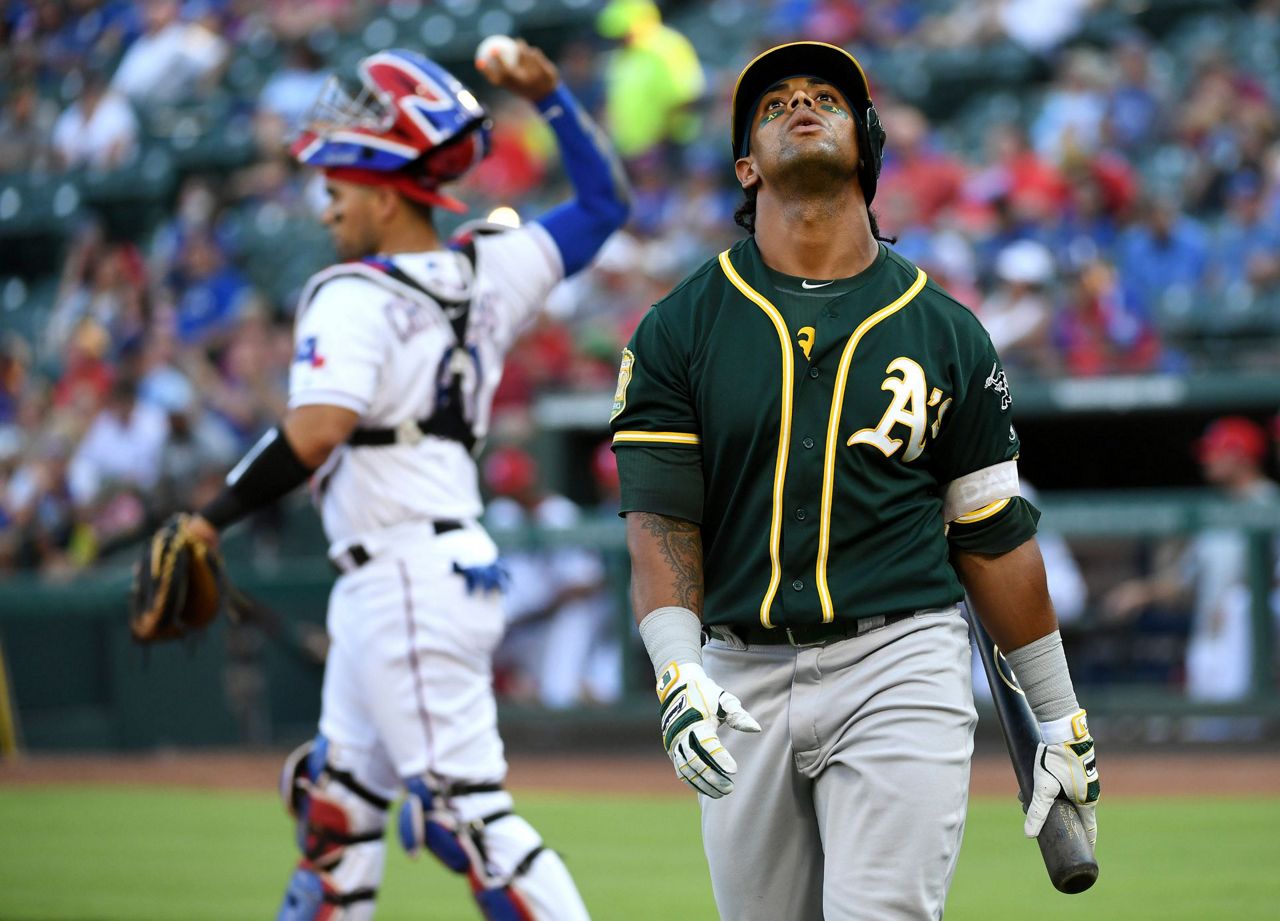 Davis hits 2 more HRs, A's rally again to beat Rangers 6-5