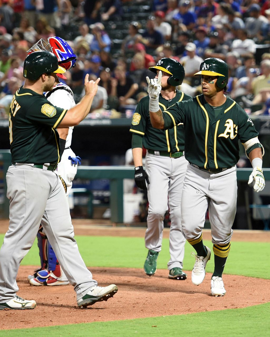 Davis hits 2 more HRs, A's rally again to beat Rangers 6-5