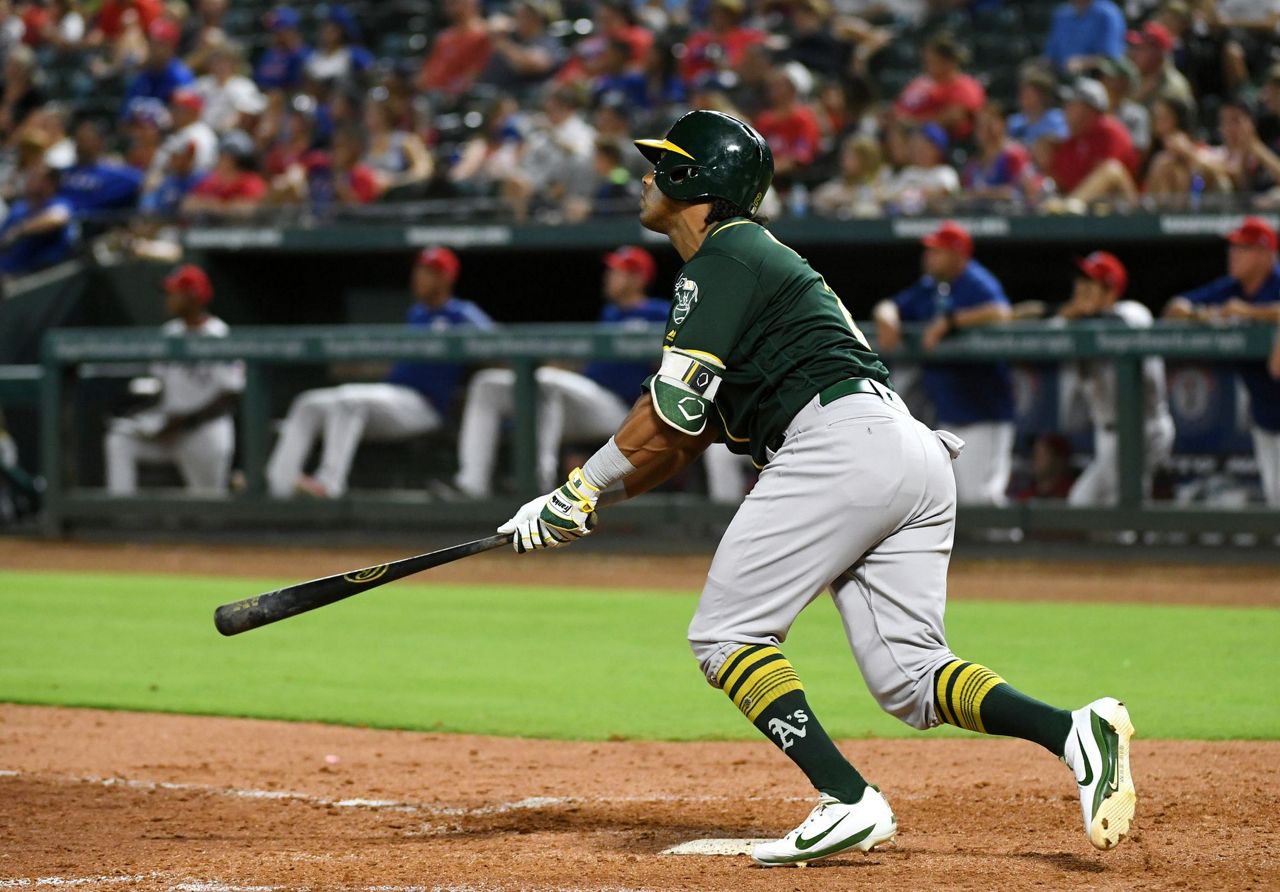 Davis hits 2 more HRs, A's rally again to beat Rangers 6-5