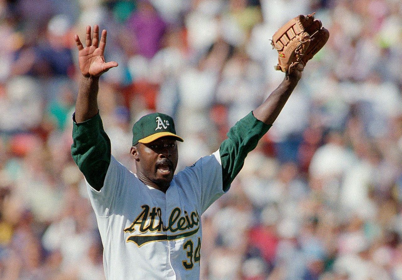 Dave Stewart and Rickey Henderson celebrate in the Blue Jays