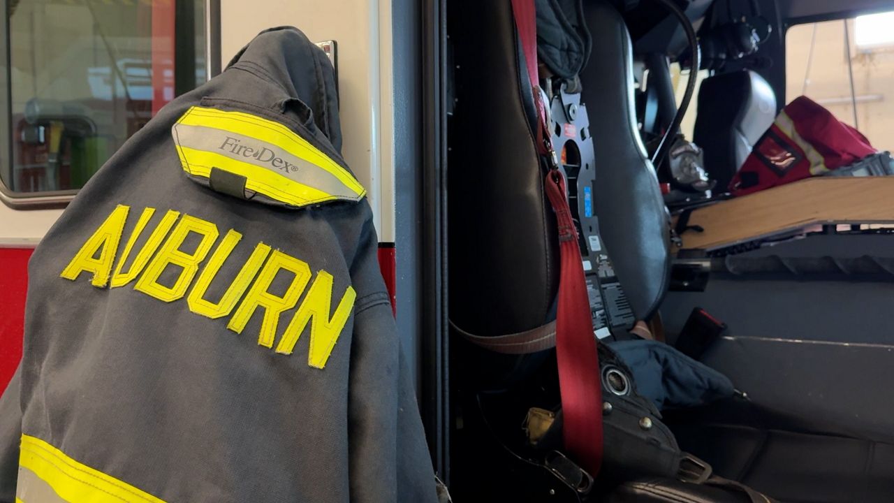 Auburn Firefighter jacket hanging at the West Street station. (Spectrum News 1/Dan Reidy)