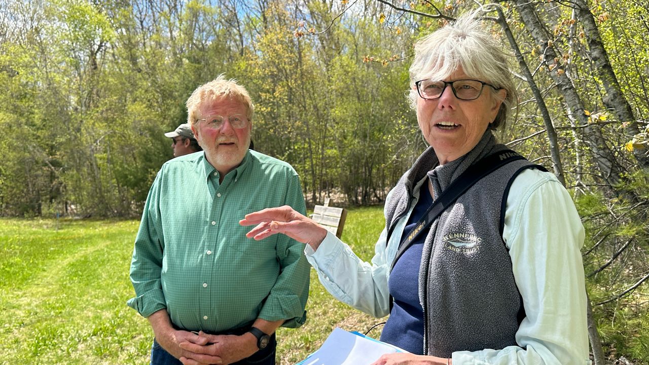 Hallowell Mayor George Lapointe and Kennebec Land Trust Executive Director Theresa Kerchner talk about the Howard Hill Universal Access Trail during a tour on Monday. (Spectrum News/Susan Cover)