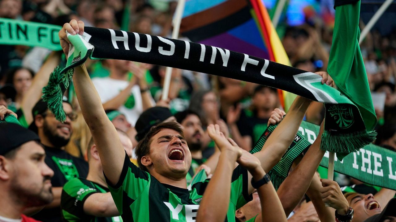 Fans cheer for Austin FC during an MLS soccer match against the Columbus Crew, Sunday, June 27, 2021, in Austin, Texas. (AP Photo/Eric Gay)