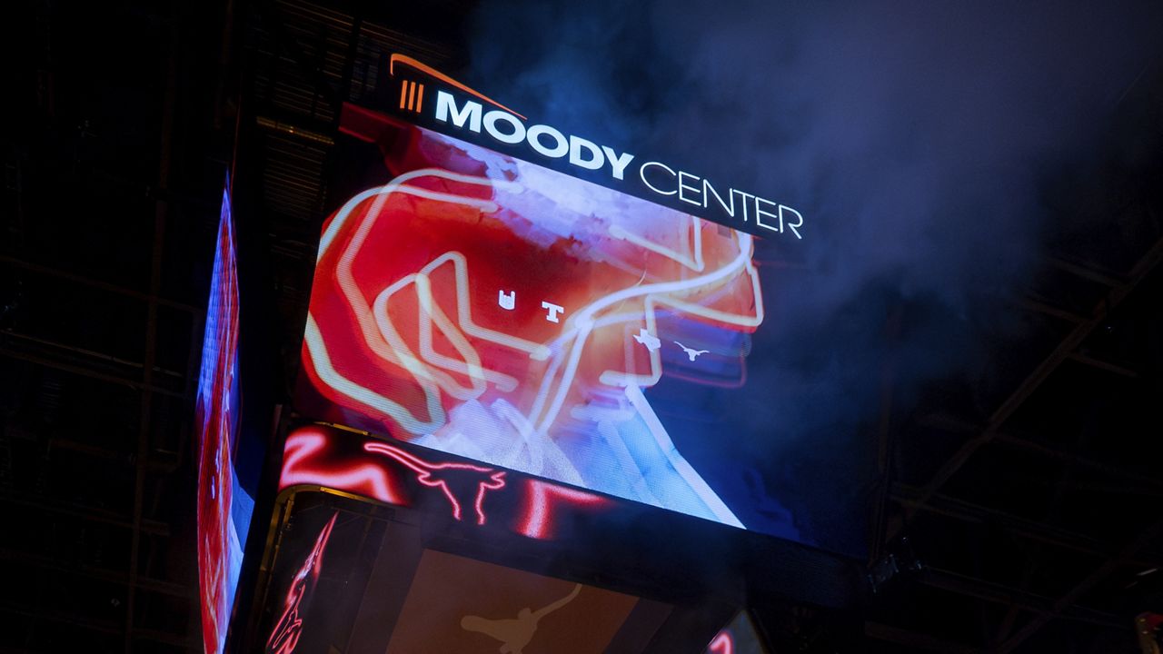 The Moody Center scoreboard displays University of Texas Longhorn graphics during the first half of an NCAA college basketball game, Friday, Dec. 22, 2023, in Austin, Texas. (AP Photo/Michael Thomas)