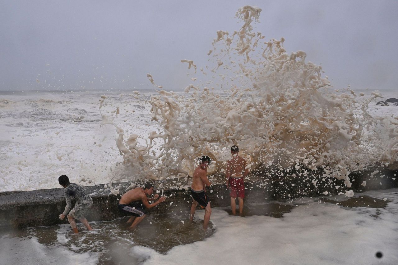 Australian homes lose power and people evacuate as tropical cyclone ...