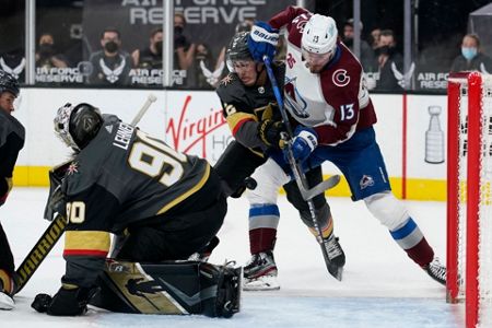 From left to right, Vegas Golden Knights defenseman Alec Martinez,  goaltender Marc-Andre Fleury and defenseman Zach Whitecloud celebrate as  time runs out in the third period of an NHL hockey game against