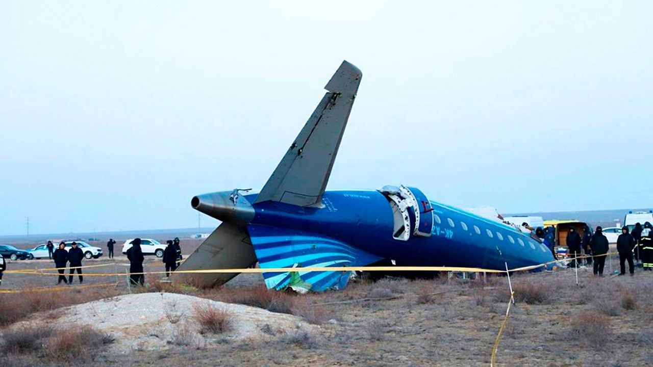 In this photo taken from a video released by the administration of Mangystau region, a part of Azerbaijan Airlines' Embraer 190 lies on the ground near the airport of Aktau, Kazakhstan, on Thursday, Dec. 26, 2024. (The Administration of Mangystau Region via AP)