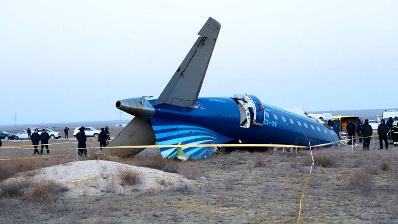 In this photo taken from a video released by the administration of Mangystau region, a part of Azerbaijan Airlines' Embraer 190 lies on the ground near the airport of Aktau, Kazakhstan, on Thursday, Dec. 26, 2024. (The Administration of Mangystau Region via AP)