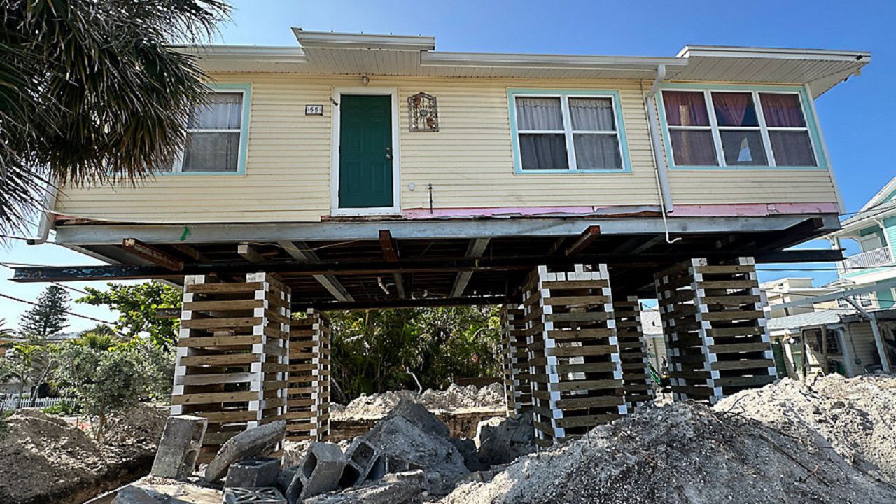 The home in Treasure Island's Sunset Beach neighborhood has been lifted to comply with building code and floodplain regulations (Angie Angers). 