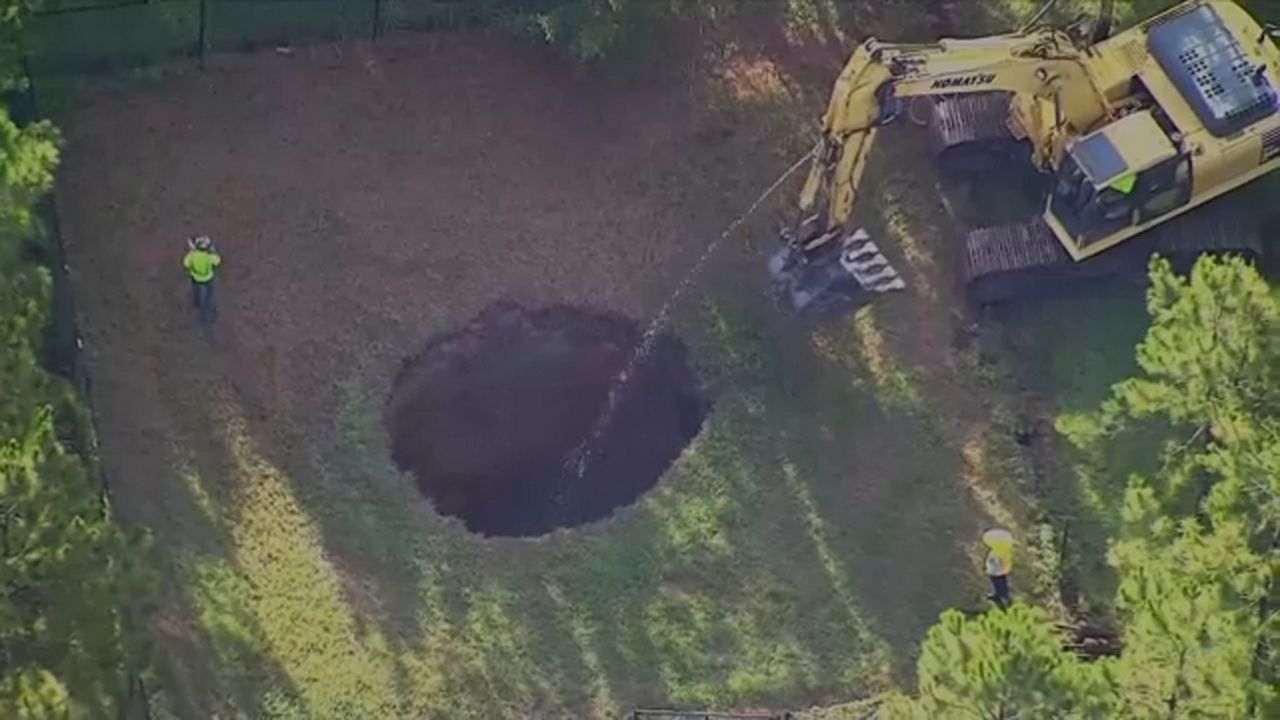 Crews begin filling in recently reopened Seffner sinkhole