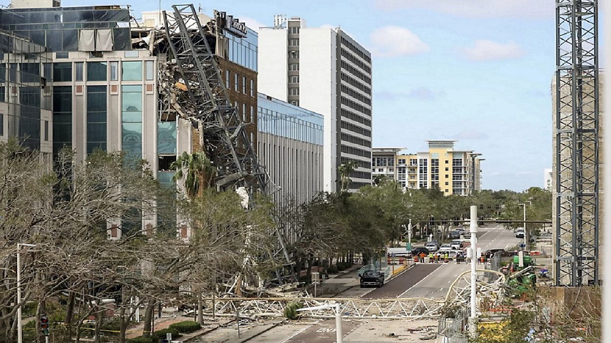 No one was injured last October when the crane working on a 46-story condominium and office building, which will be the tallest residential tower on Florida’s Gulf Coast, and crashed into a nearby building. (Spectrum News image)