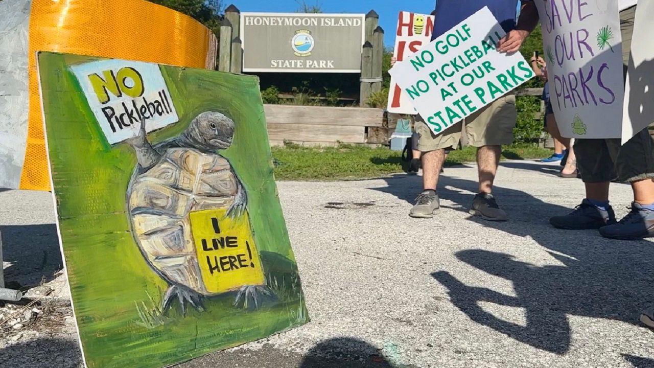 Members of the Sierra Club Florida Chapter have been protesting the state's proposals to add pickleball courts and golf courses to state parks. (Spectrum News/Anthony Sande)