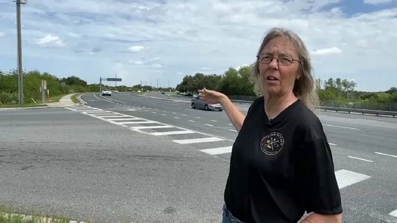 Trinity resident Elizabeth Kipphorn describes the dangers she often sees at State Road 54 and Mitchell Ranch Road. (Spectrum News image)