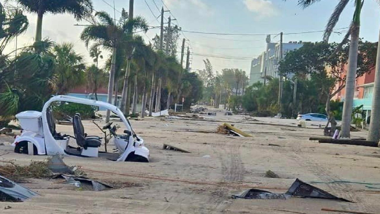 Hurricane Helene deposited tons of sand into the streets of Treasure Island and other communities, burying vehicles and debris. (Courtesy of Treasure Island Police Department)