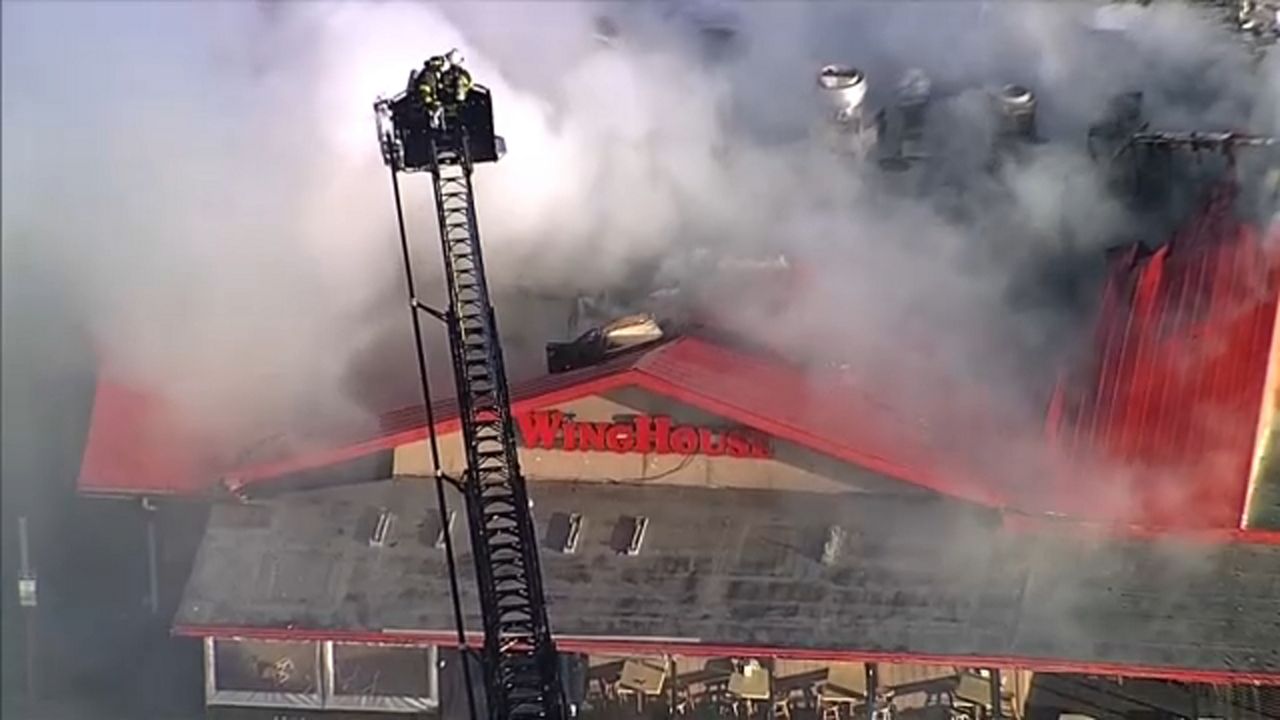 The two-alarm fire broke out at the business in the 8000 block of W. Hillsborough Street. (Sky 9)