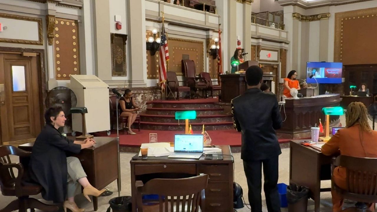 St. Louis mayor Cara Spencer (left) looks on Friday as alderman Rasheen Aldridge introduces a bill that would create a tornado relief and recovery fund in the wake of the May 16 tornado that killed five people and did more than $1 billion in damage. (Spectrum News/Gregg Palermo)